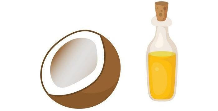 Close up of sliced coconut and its oil in a bottle.